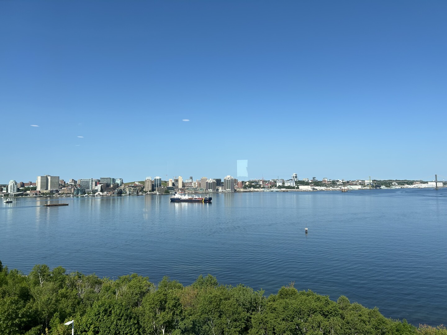 View from the board room looking over the harbour to Halifax - with small boat in water