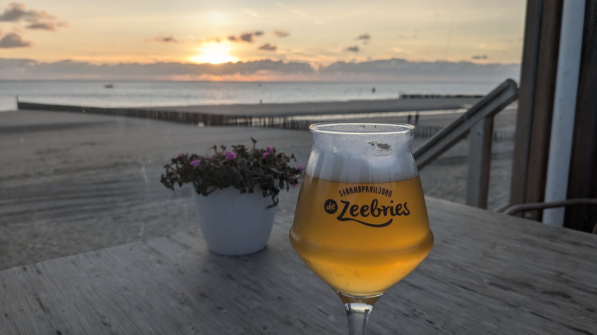 A nice glass of beer and sunset at the beach