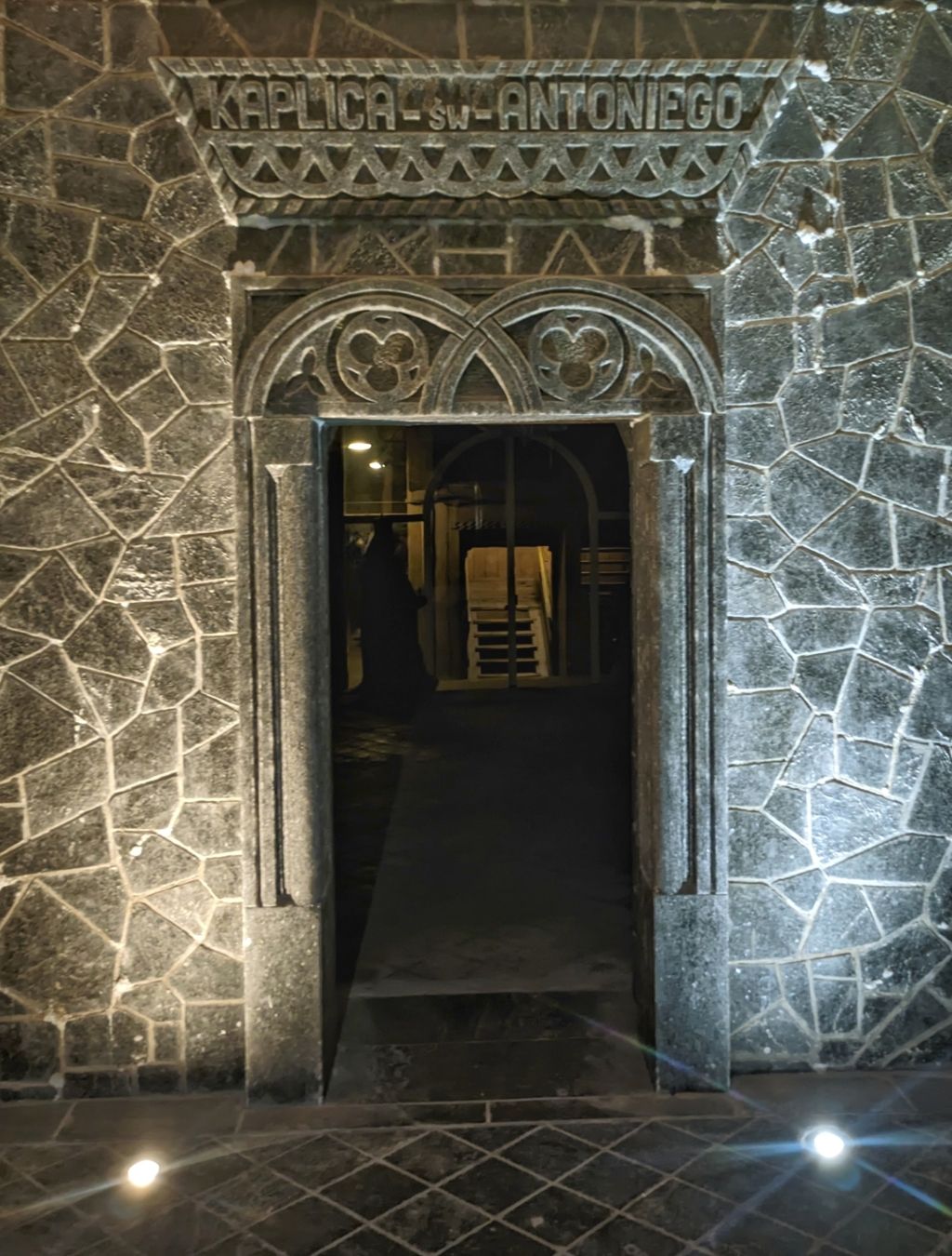 an intricate stone chapel door of a St Anthony's chapel with its name engraved above the entrance