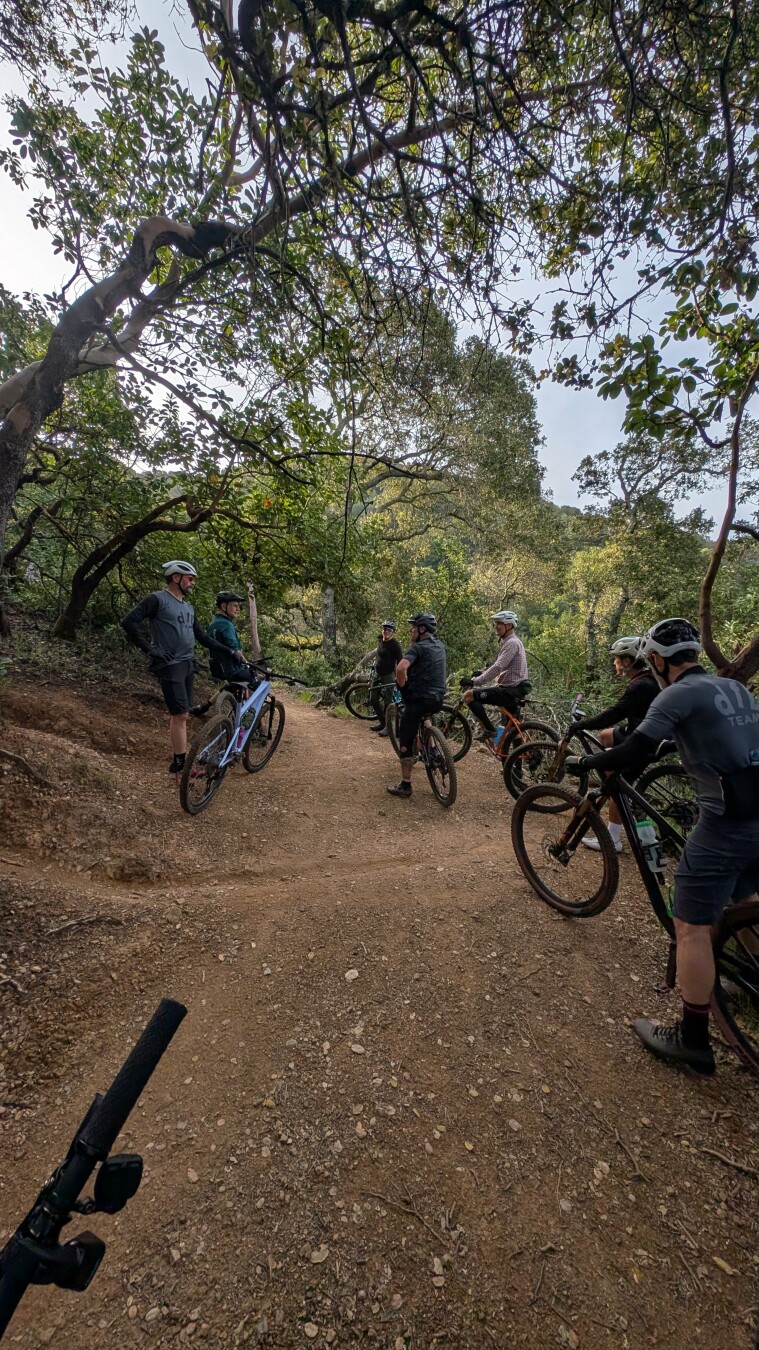 Mountain bikers at a trail intersection