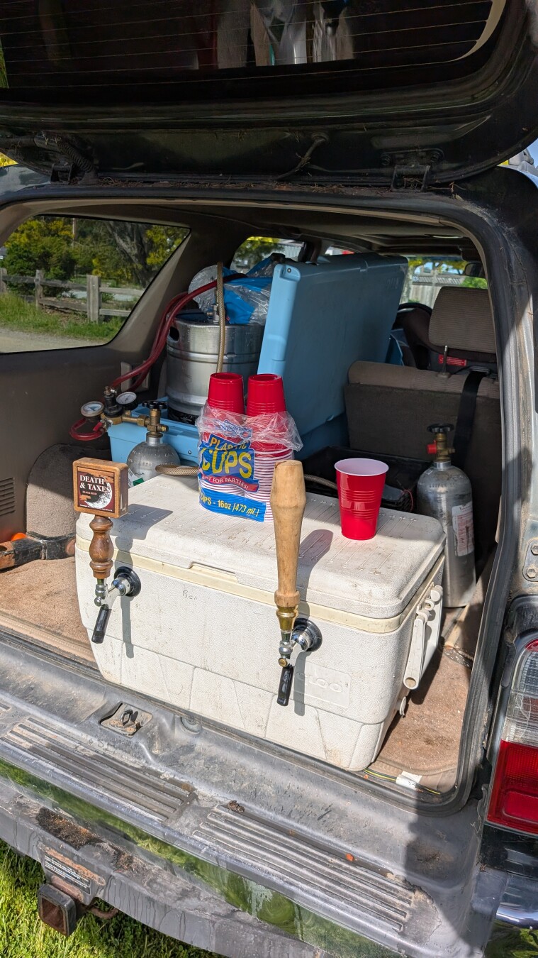 Beer taps on a cooler, representing full beer kegs
