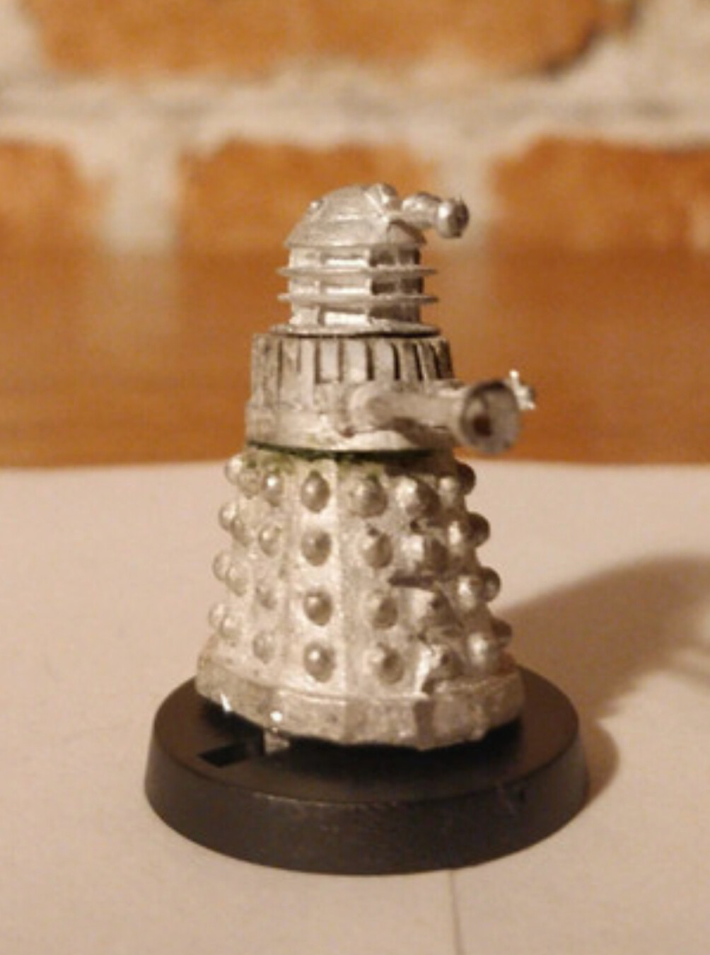 A white metal 25mm scale Dalek figure from the Dr Who universe.