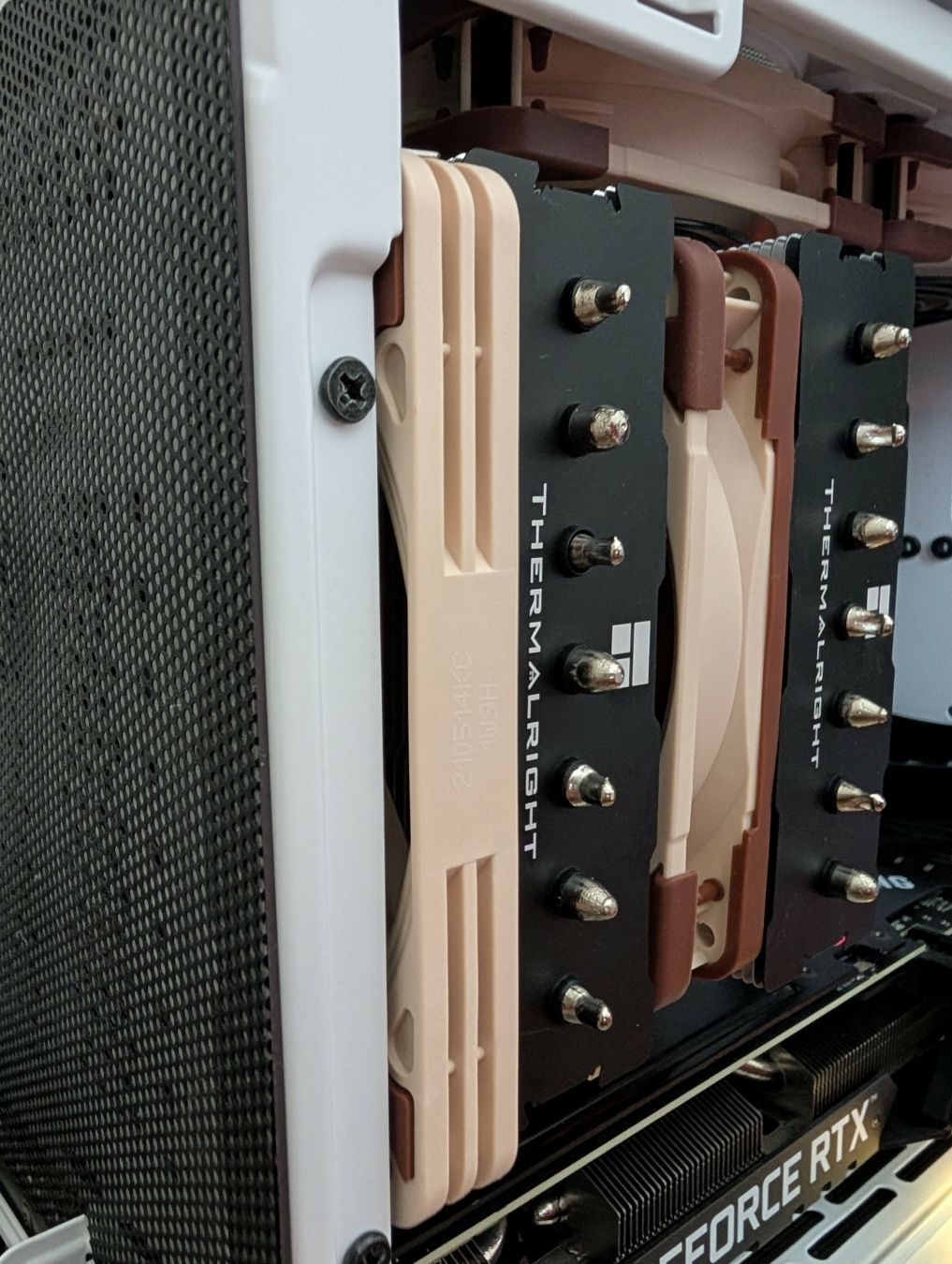 Picture of a Thermalright Phantom Spirit 120 inside an NR200 case, displaying fitment using a Noctua NF-A12x25 and NF-A12x15.