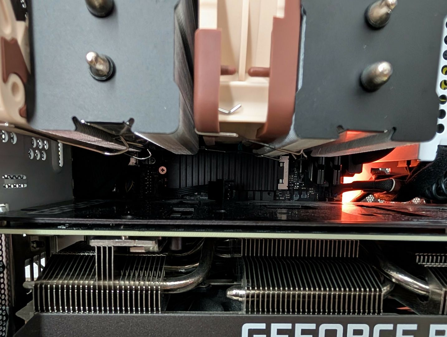Picture of a Thermalright Phantom Spirit 120 inside an NR200 case, displaying clearance of the GPU and m.2 slot.