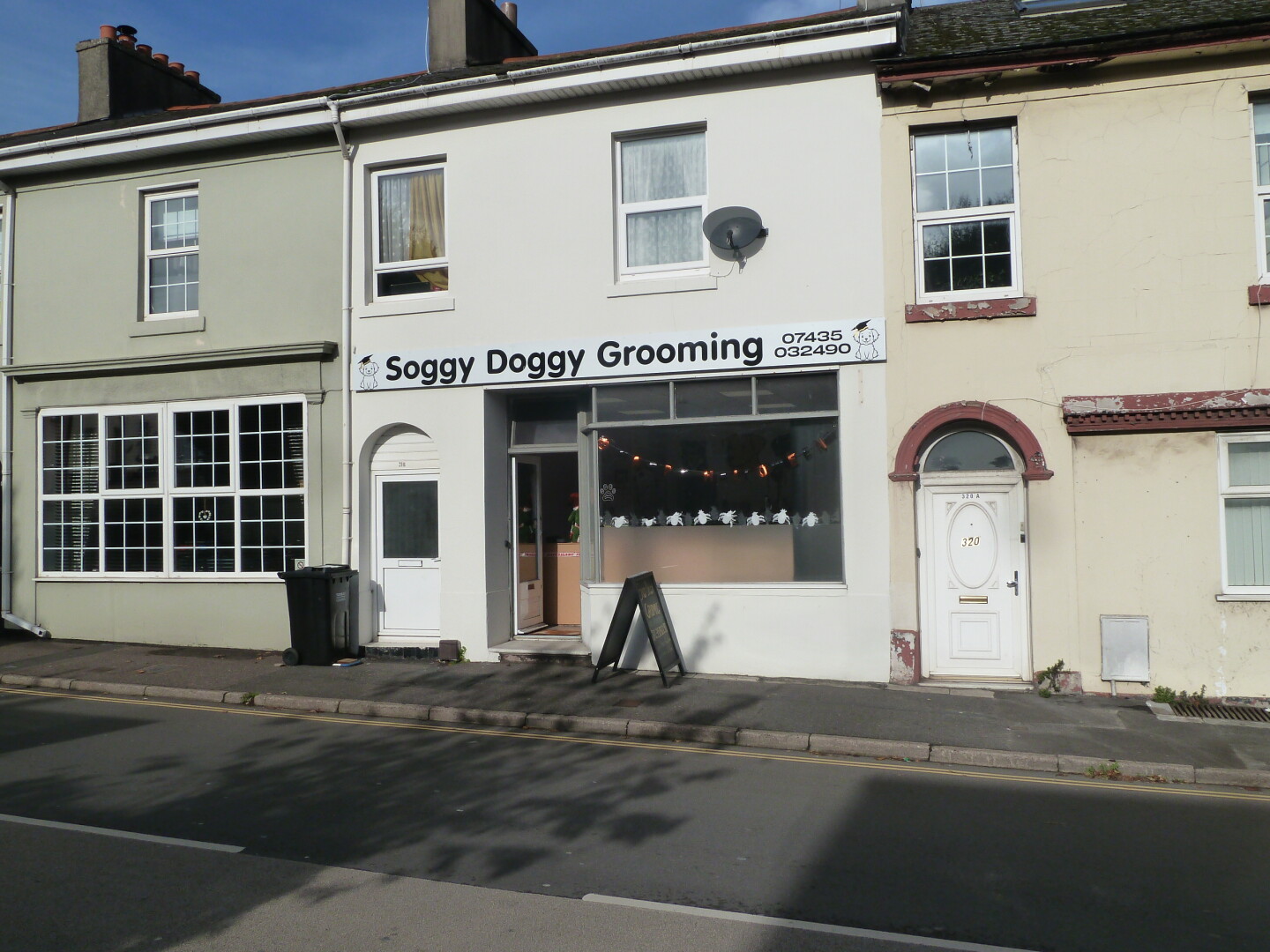 One of the roads in the area, with houses and other buildings.