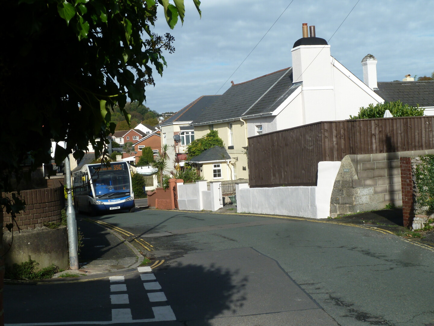 One of the roads in the area, with houses and other buildings.