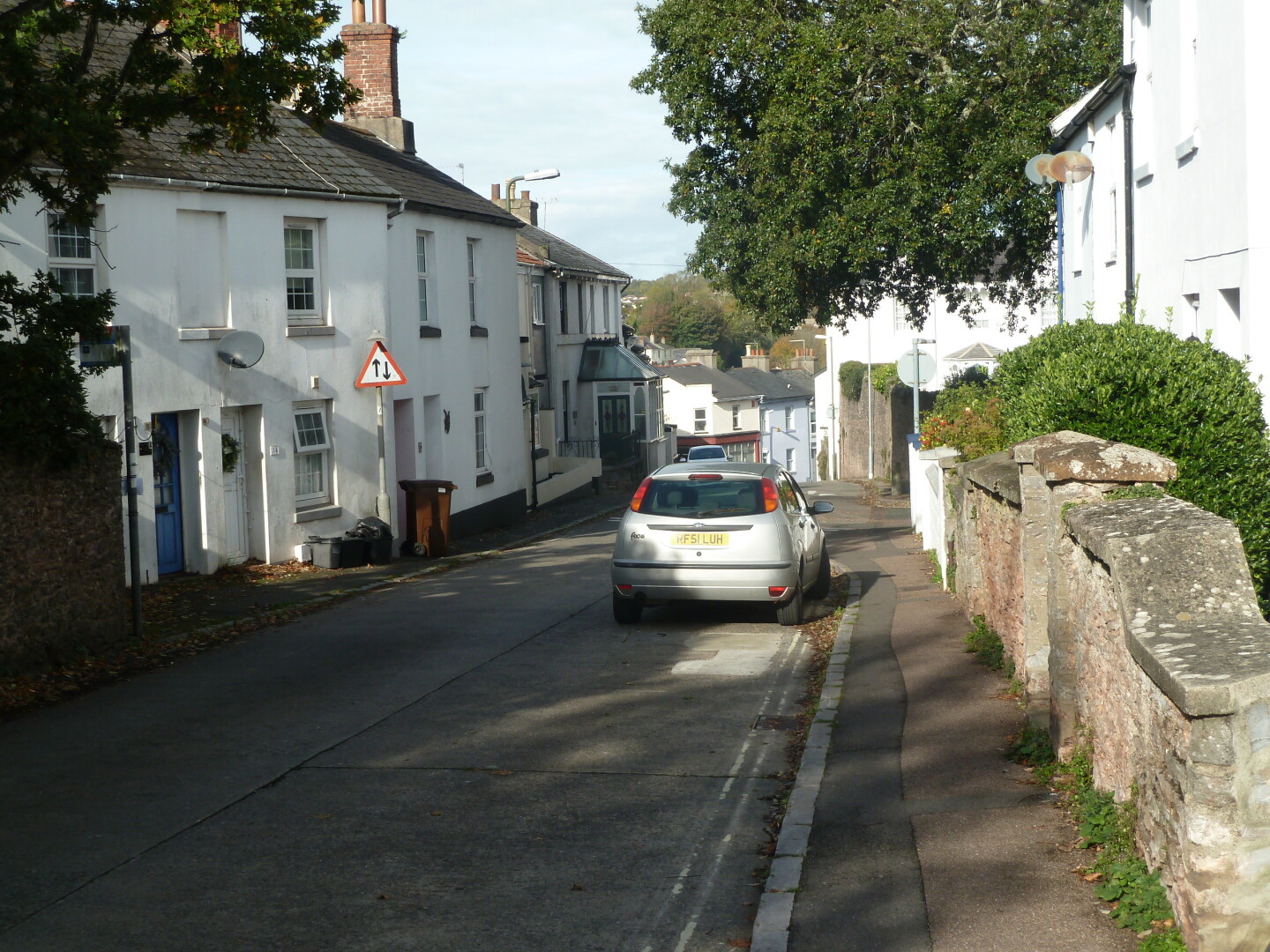 One of the roads in the area, with houses and other buildings.