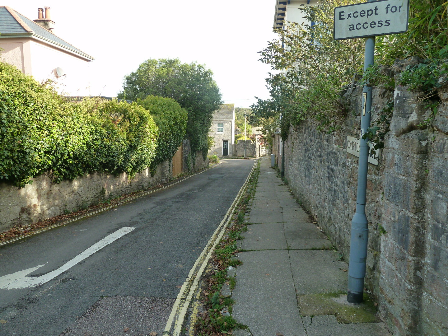 One of the roads in the area, with houses and other buildings.