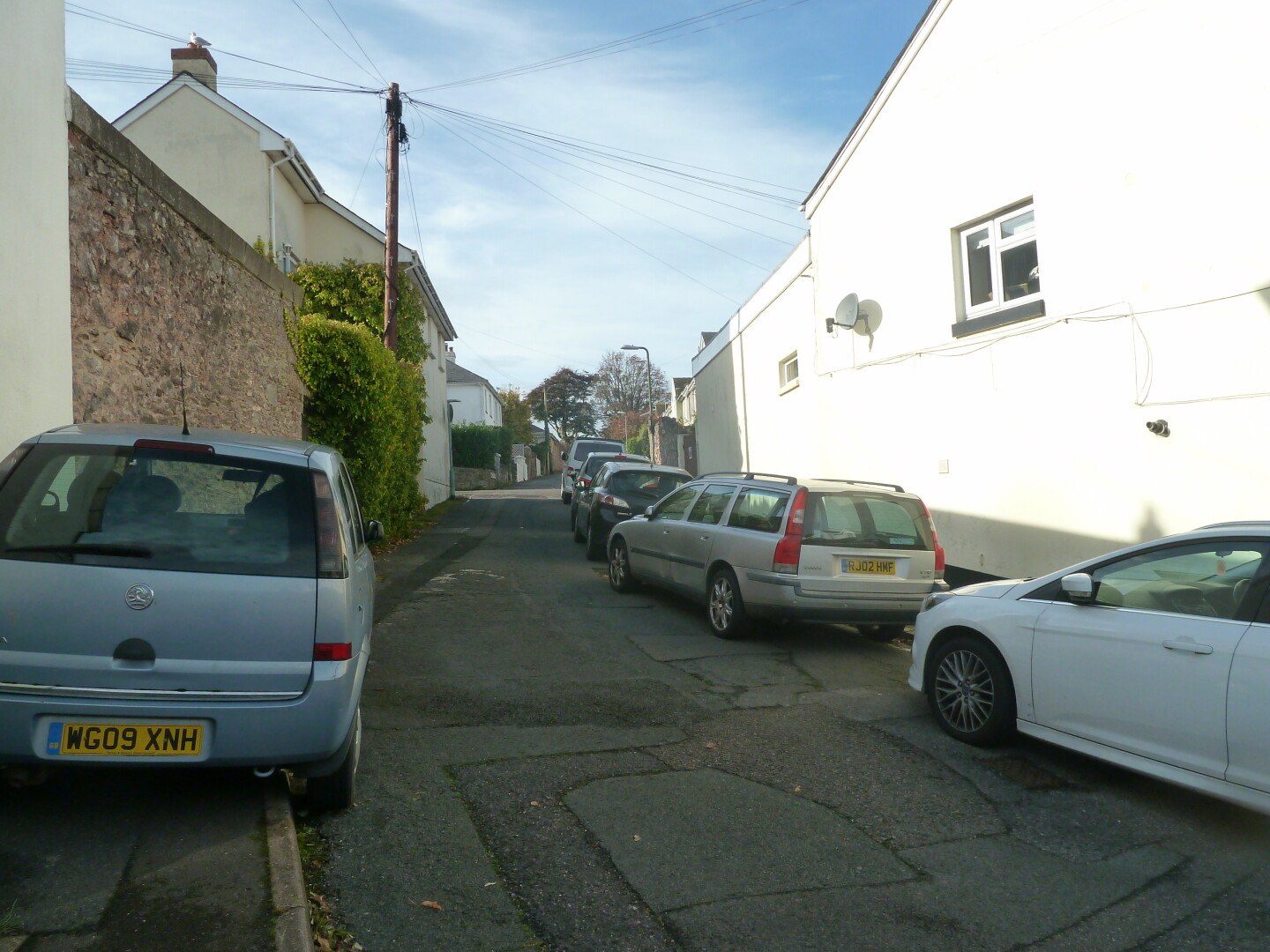 One of the roads in the area, with houses and other buildings.