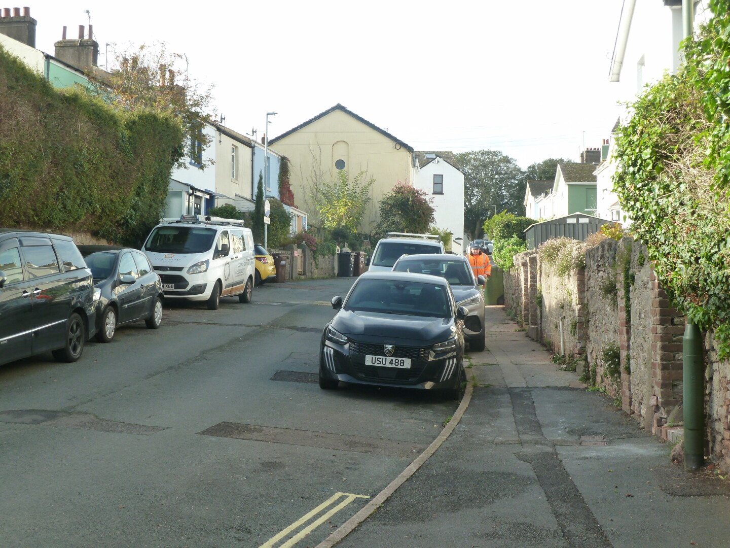One of the roads in the area, with houses and other buildings.