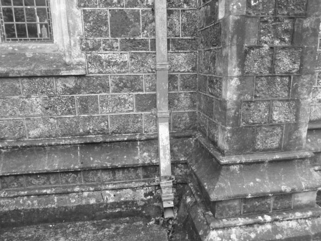 Photo of the C of E Churchyard in St. Marychurch, Torquay   Drain downpipe against the wall of the church.