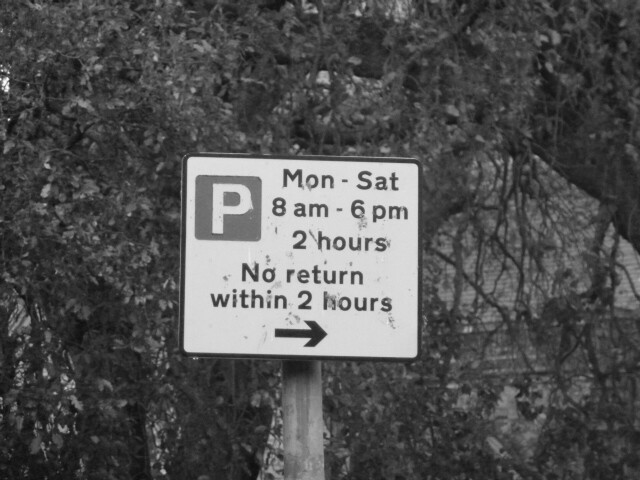 Parking restrictions sign, Mon to Sat 8pm to 6pm 2 hours no return within 2 hours.