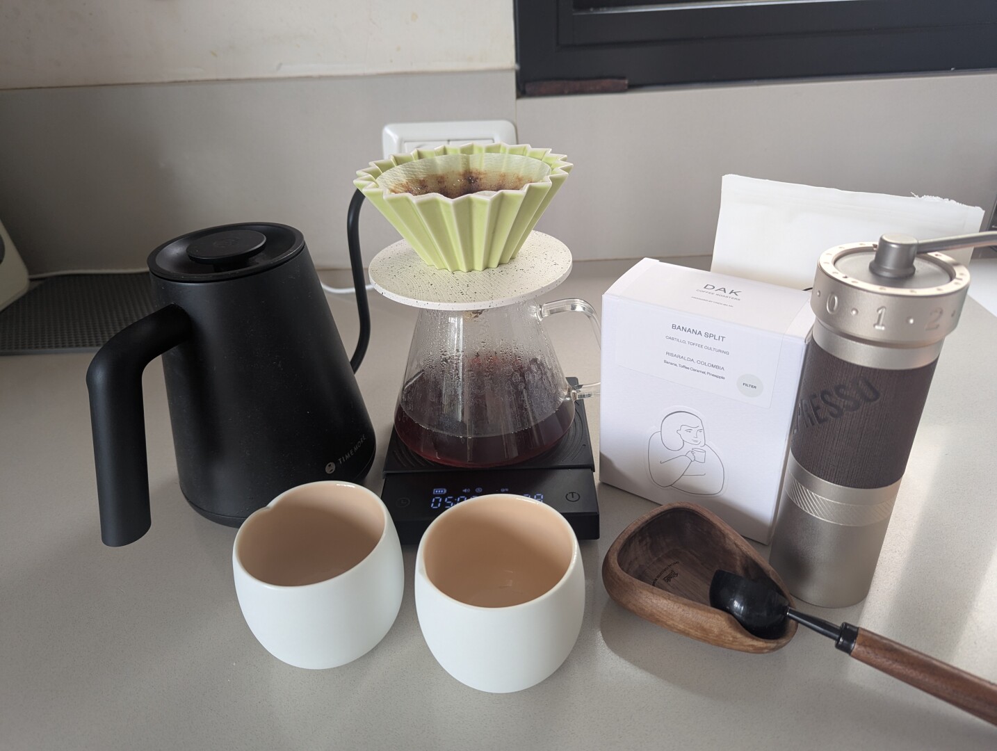 pourover setup: timemore kettle and timemore scale, origami dripper and server, zp6 and Dak coffee
