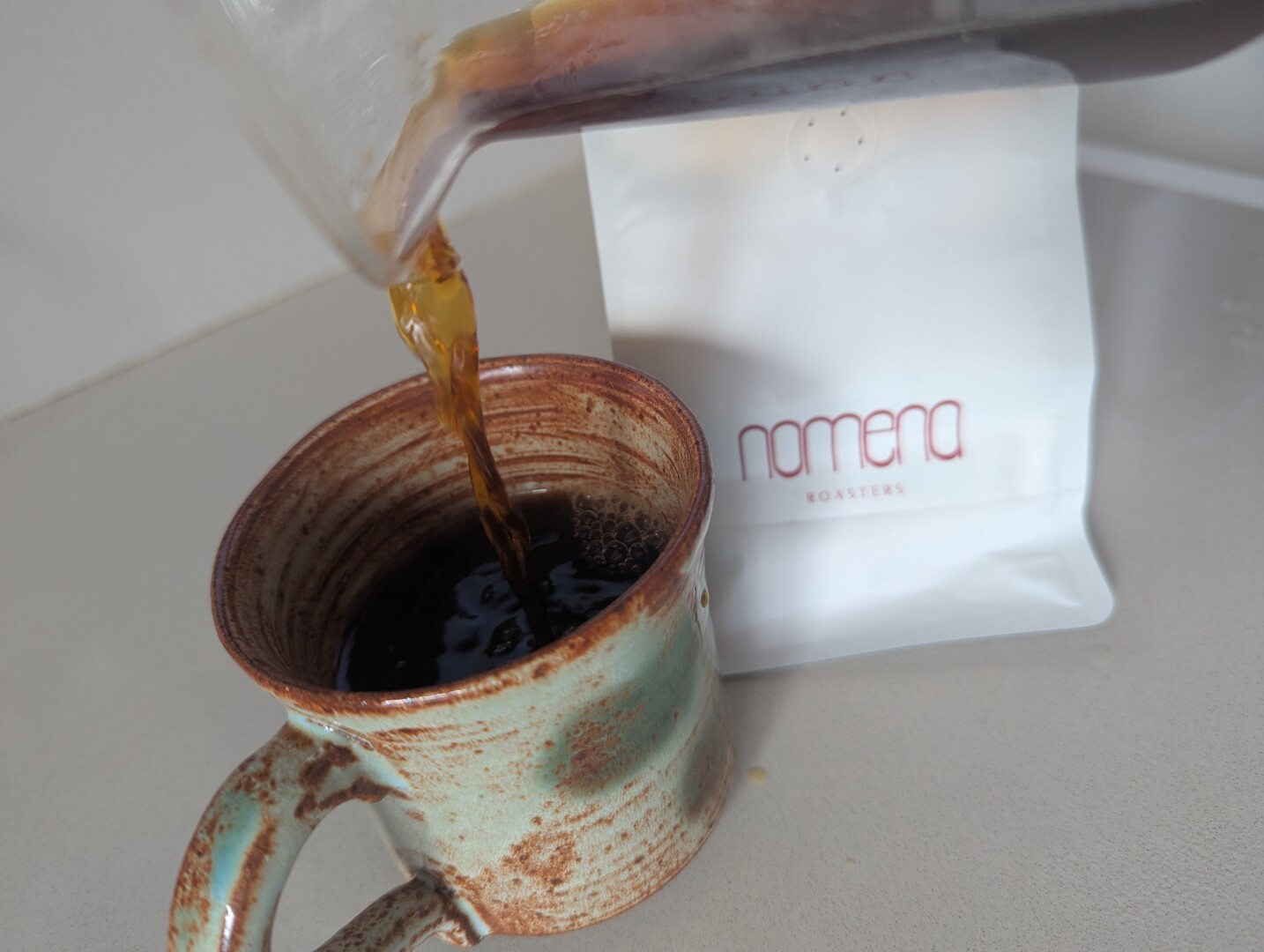 pouring coffee into the mug