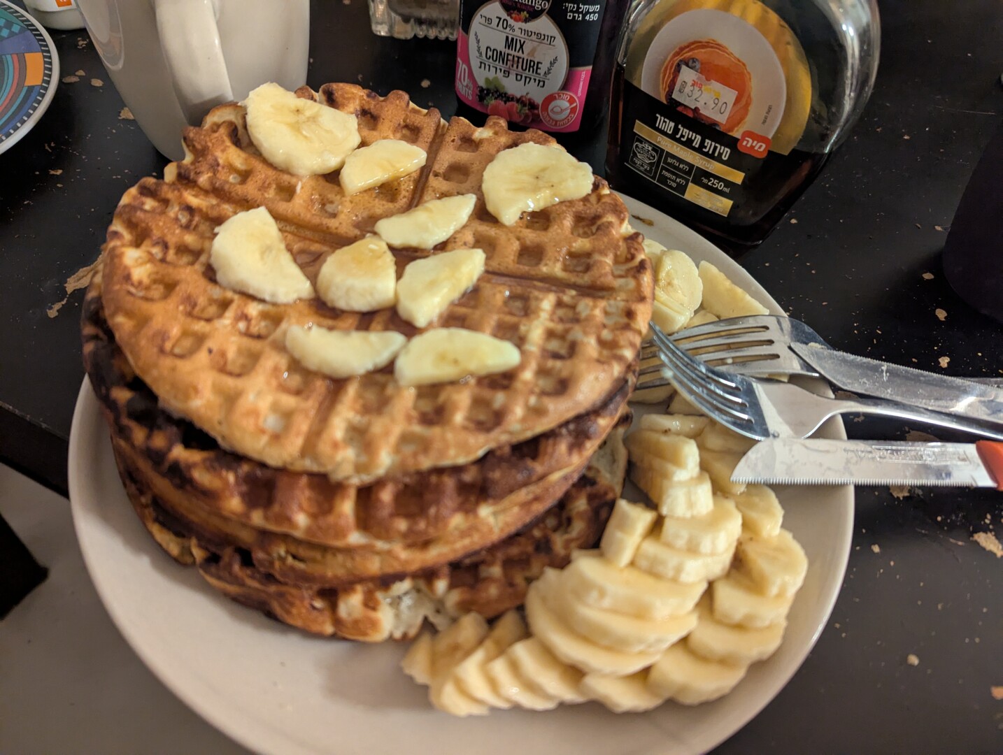 Belgium waffles on the plate with slices of banana