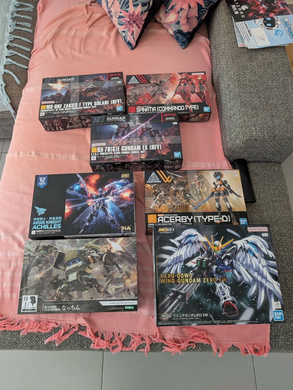 Overview picture of 7 boxes of gunpla.