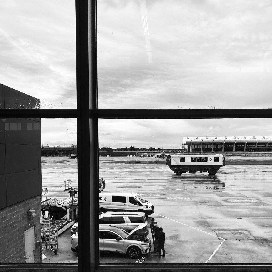 black and white photograph of Dulles Airport, Virginia, USA, showing Mobilounge and various activities