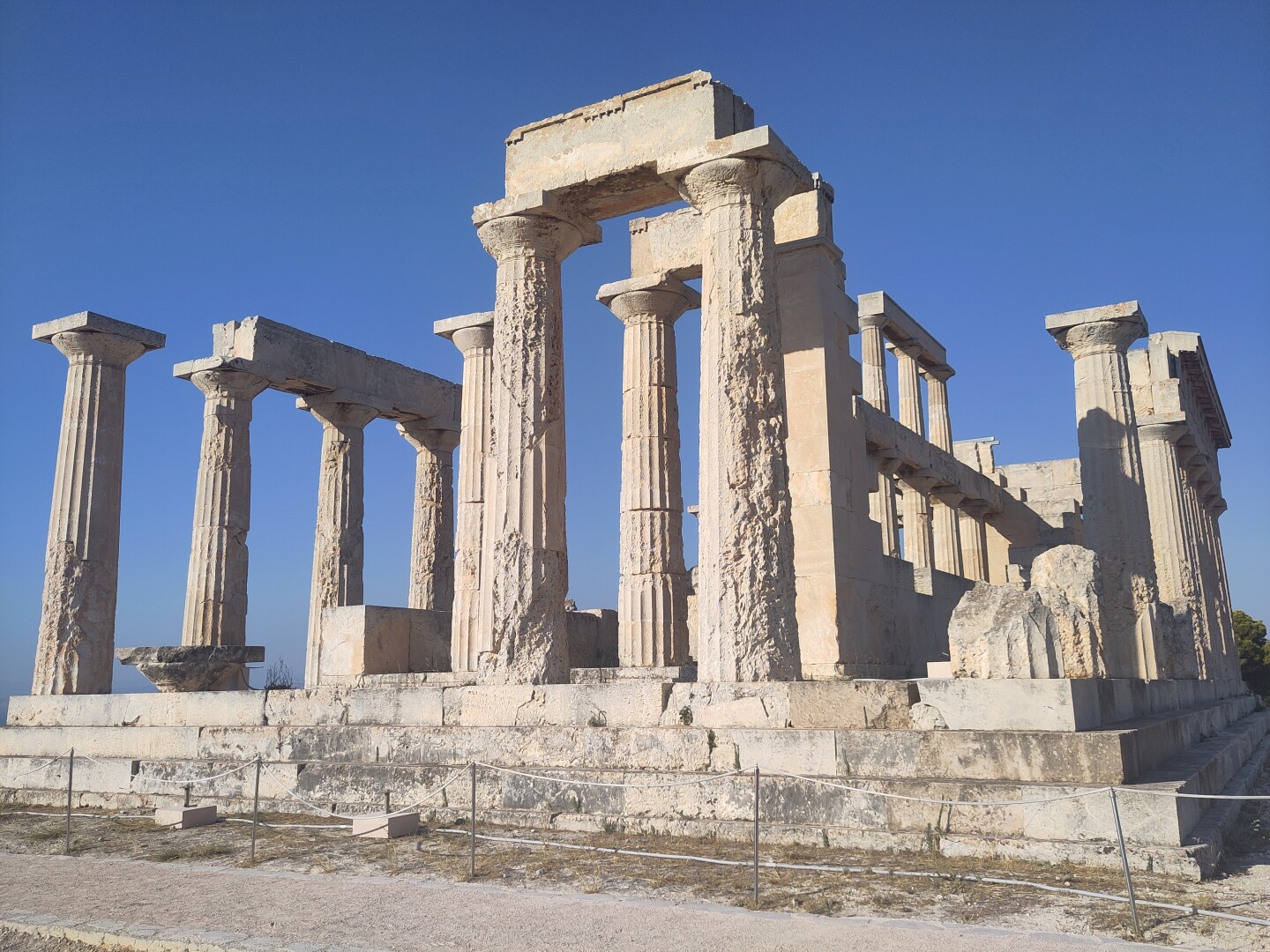 The Temple of Aphaia: a relatively well preserved ruin with several layers of doric column rows on top of marble steps.