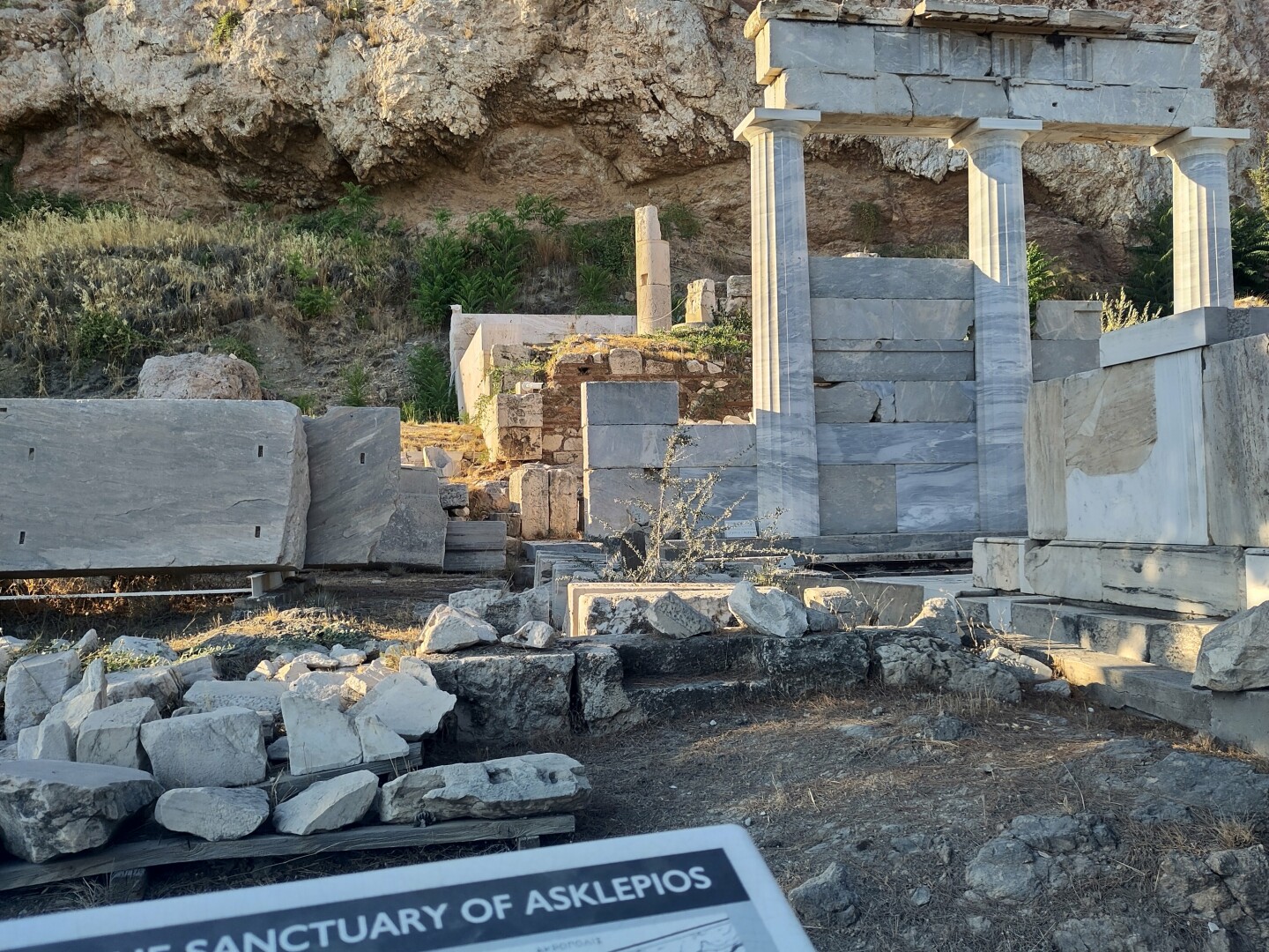 The sanctuary of Asklepios, the god of medicine, on the Athenian Acropolis: its remains mainly three columns supporting a small bit of wall. My very first glimpse of "my boy"!